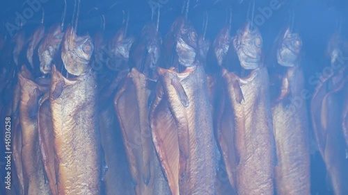 preparing smoked fish. Dish from rainbow trout photo