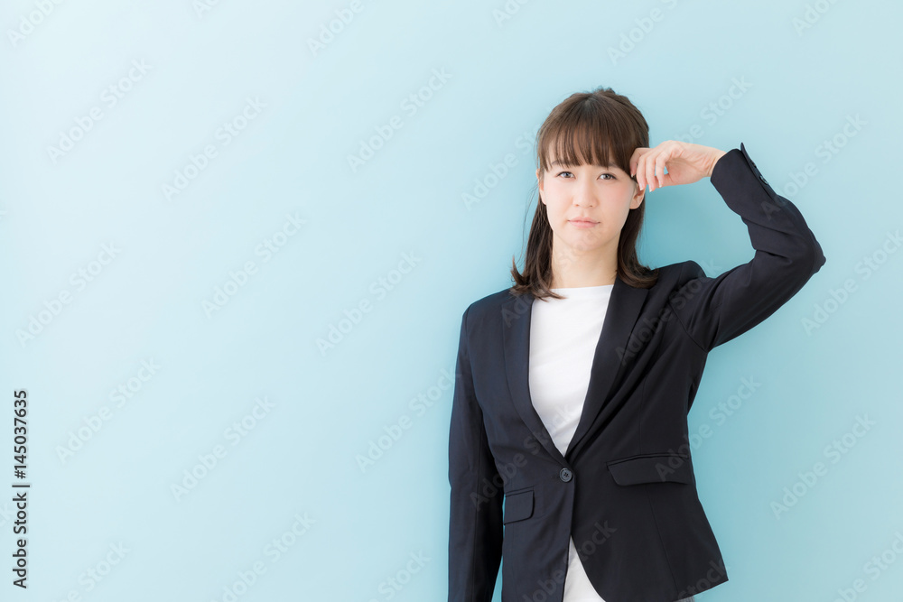 portrait of asian businesswoman isolated on blue background portrait of asian businesswoman isolated on blue background