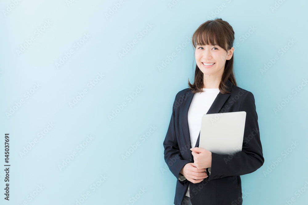 portrait of asian businesswoman isolated on blue background portrait of asian businesswoman isolated on blue background