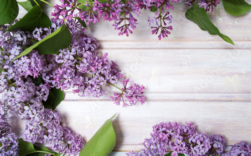 Fresh lilac flowers on a wooden table