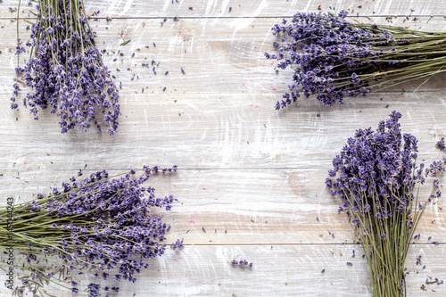 dry laveder bouquet on wooden background top view space for text