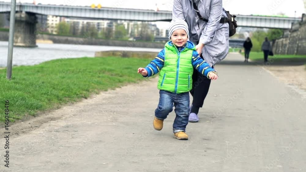 Little boy running, playing with mother in city, super slow motion 240fps
Little boy running, playing with mother in city, super slow motion 240fps