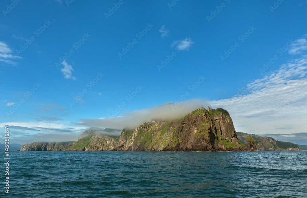 Rocks in the Avacha Bay of the Pacific Ocean. Coast of Kamchatka.