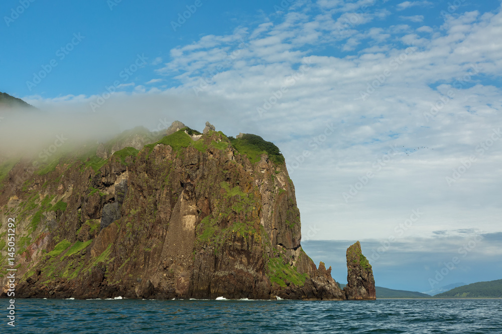 Rocks in the Avacha Bay of the Pacific Ocean. Coast of Kamchatka.