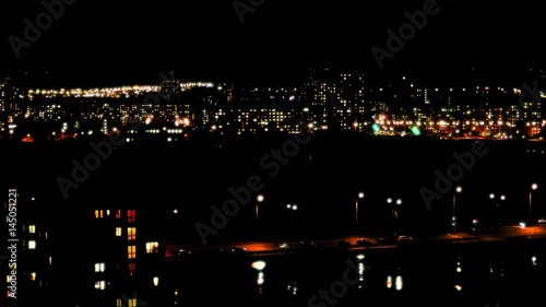 Wallpaper Mural Night City Lights / Big City Landscape / Night Life. City lights twinkle, windows of high-rise buildings light up and go out, cars with headlights drive on roads. Torontodigital.ca