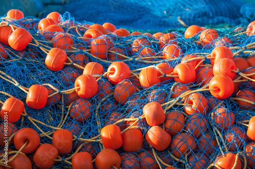Bright fishing net with floats closeup