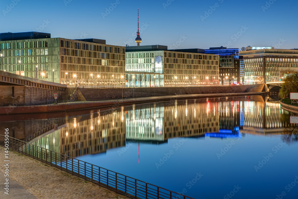 Fototapeta premium Office buildings at the river Spree in Berlin with the Television tower in the back