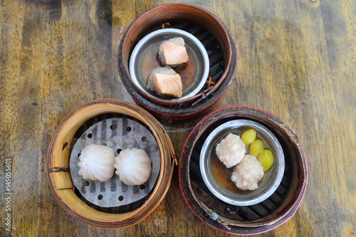 Set of Chinese steamed dimsum in bamboo containers, Chinese traditional cuisine