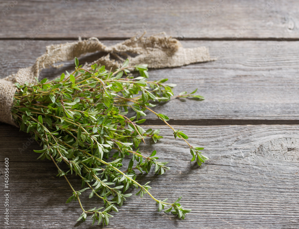 Thyme bunch on old wooden table Thyme bunch on old wooden table