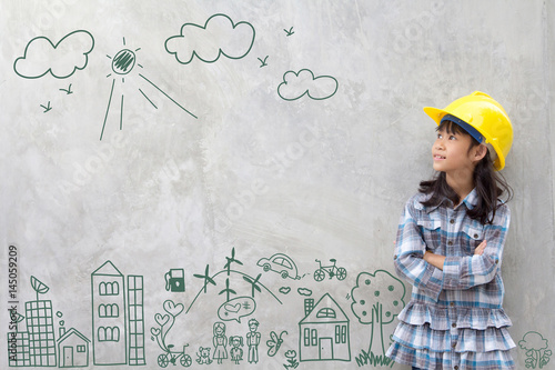 Little girl engineering with creative drawing environment with happy family, eco friendly, save energy, against a brick wall