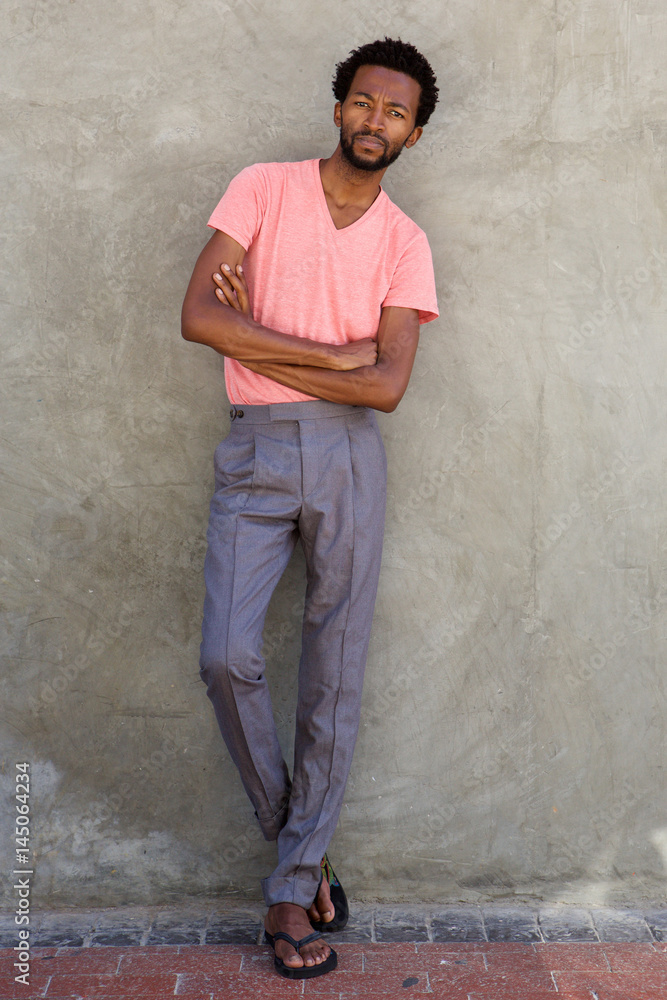 Full body handsome african american man standing with arms crossed Full body handsome african american man standing with arms crossed