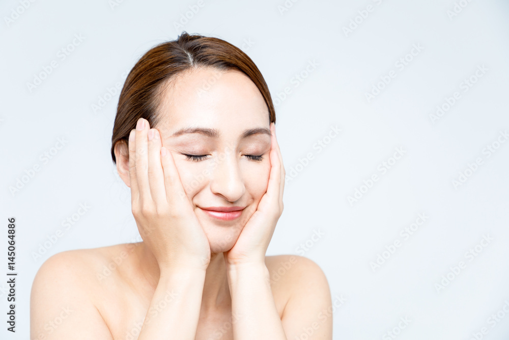 beautiful woman massaging her face. lymphatic massage. beautiful woman massaging her face. lymphatic massage.