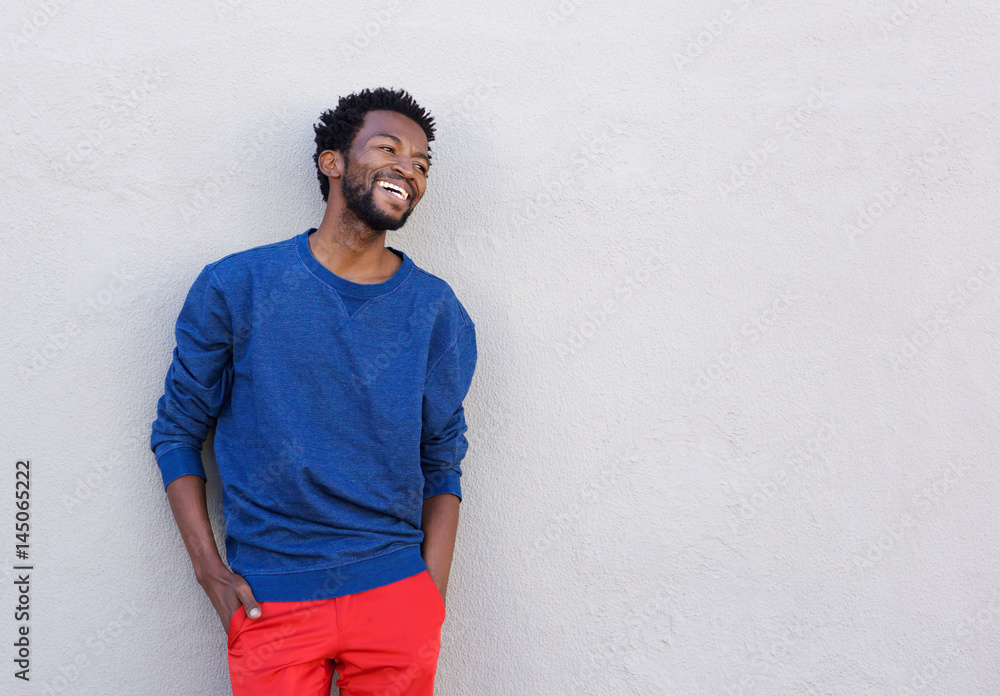 handsome african american man in red pants smiling handsome african american man in red pants smiling