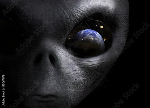 Wallpaper Mural alien looking at the earth