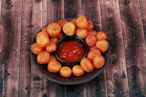 Fried mashed potato balls recipe ,Dauphine potato with tomato sauce.