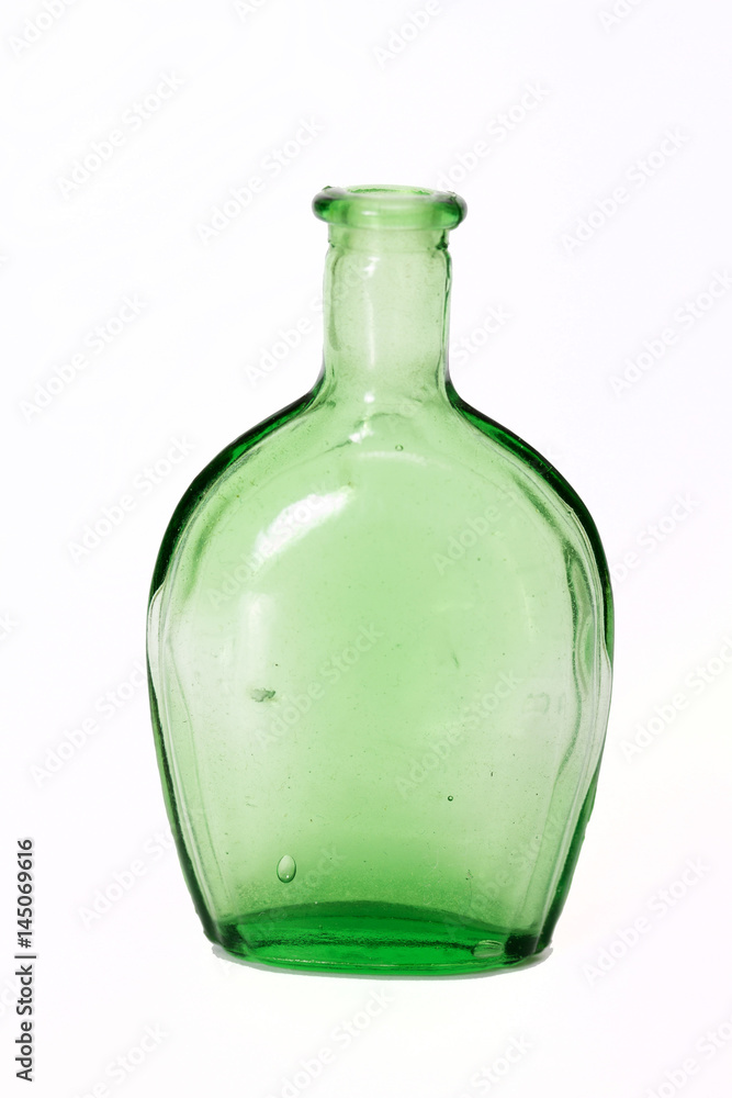 Old colourful bottles against a white background Old colourful bottles against a white background