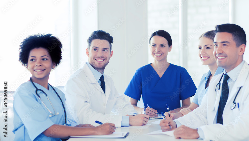 group of happy doctors meeting at hospital office group of happy doctors meeting at hospital office