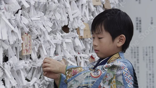 A five year old boy dressed up in a Hakama to celebrate the Shichi-Go-San Festival photo