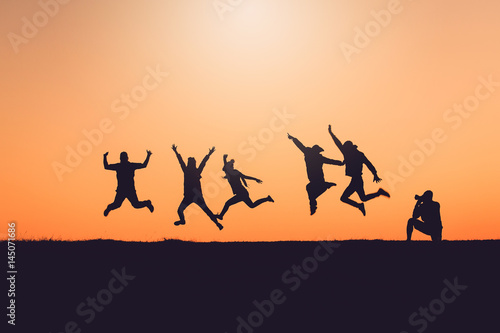 Silhouette Of People having fun at sunset time © jat306