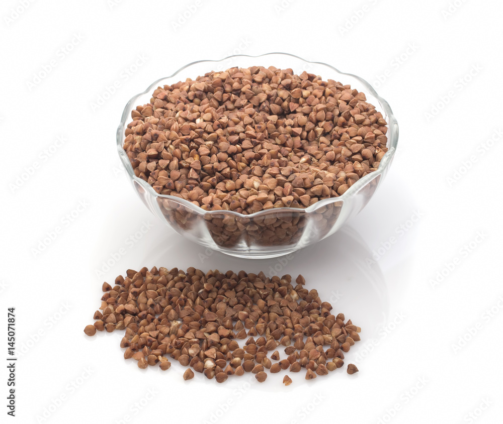 Buckwheat grain and transparent saucer isolated on white background Buckwheat grain and transparent saucer isolated on white background