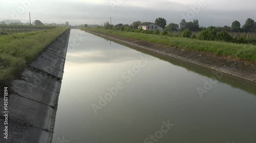 Wallpaper Mural irrigation channel in countryside supplying water in cultivated fields Torontodigital.ca