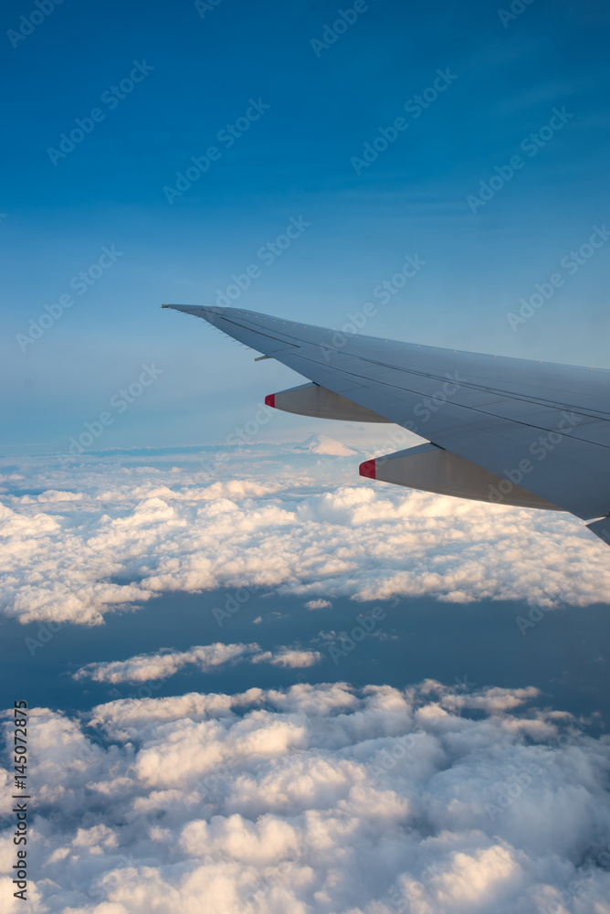View from the window plane with cloud and fuji mountain. View from the window plane with cloud and fuji mountain.