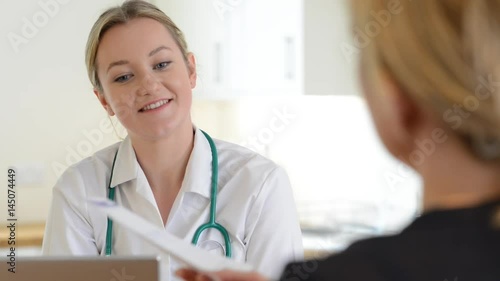 Woman Meeting With Female Doctor In Surgery