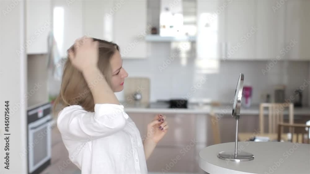 Beautiful Girl Dressing Herself at the Mirror Beautiful Girl Dressing Herself at the Mirror