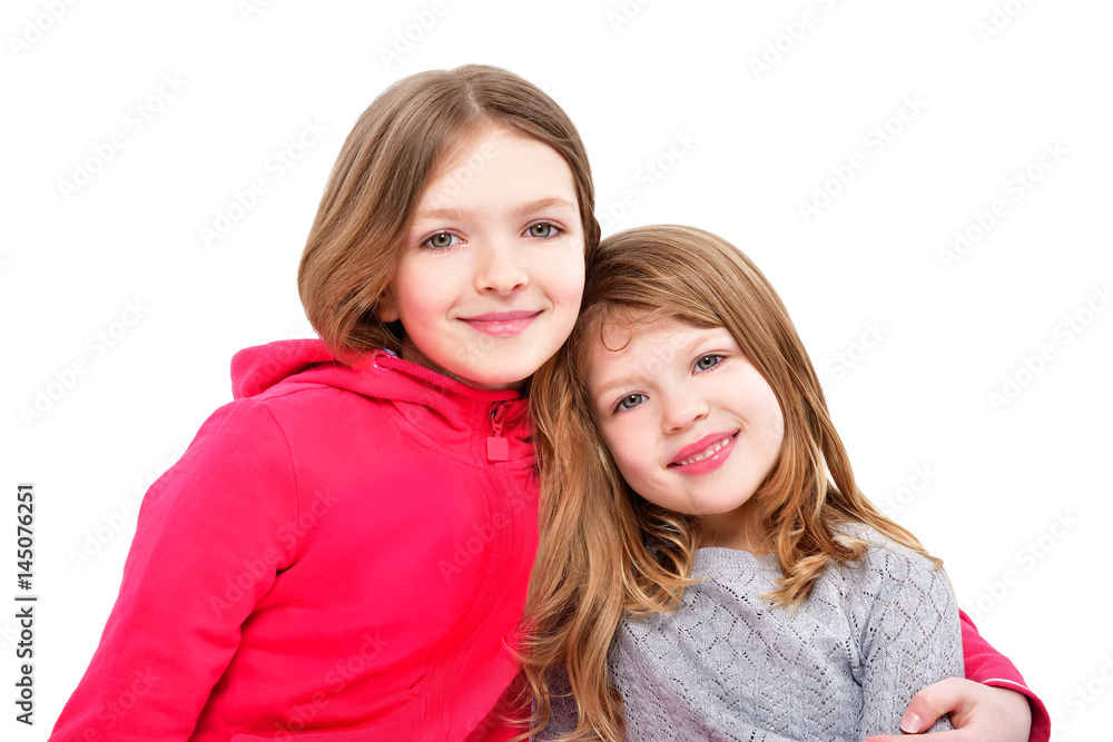 Portrait of two cute smiling girls isolated on white background Portrait of two cute smiling girls isolated on white background