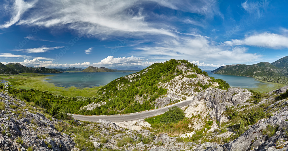 Obraz premium Panoramic view at the Montenegro part of Skadar lake with highway around. Skadar lake is a national park in Montenegro, Europe