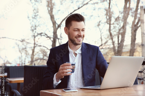 Young businessman working w...