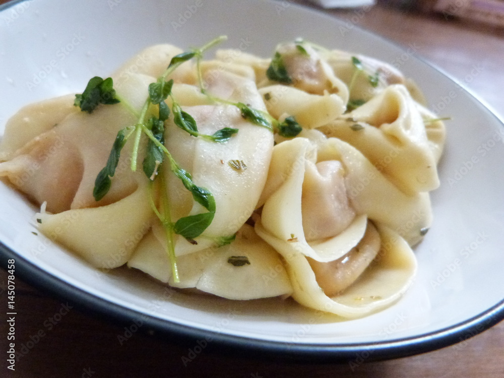 Dumplings on plate with thyme Dumplings on plate with thyme