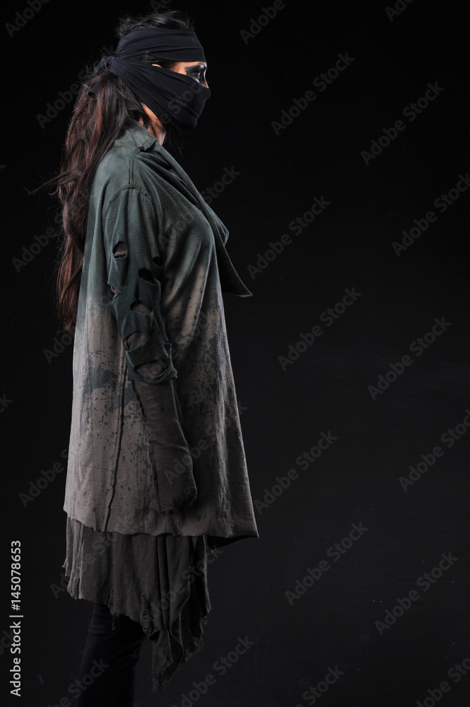 Warrior woman in different design clothes on black background Warrior woman in different design clothes on black background