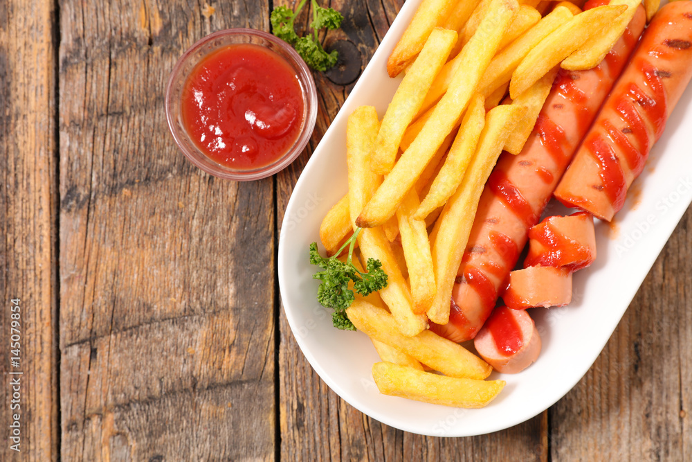 sausage and french fries and ketchup