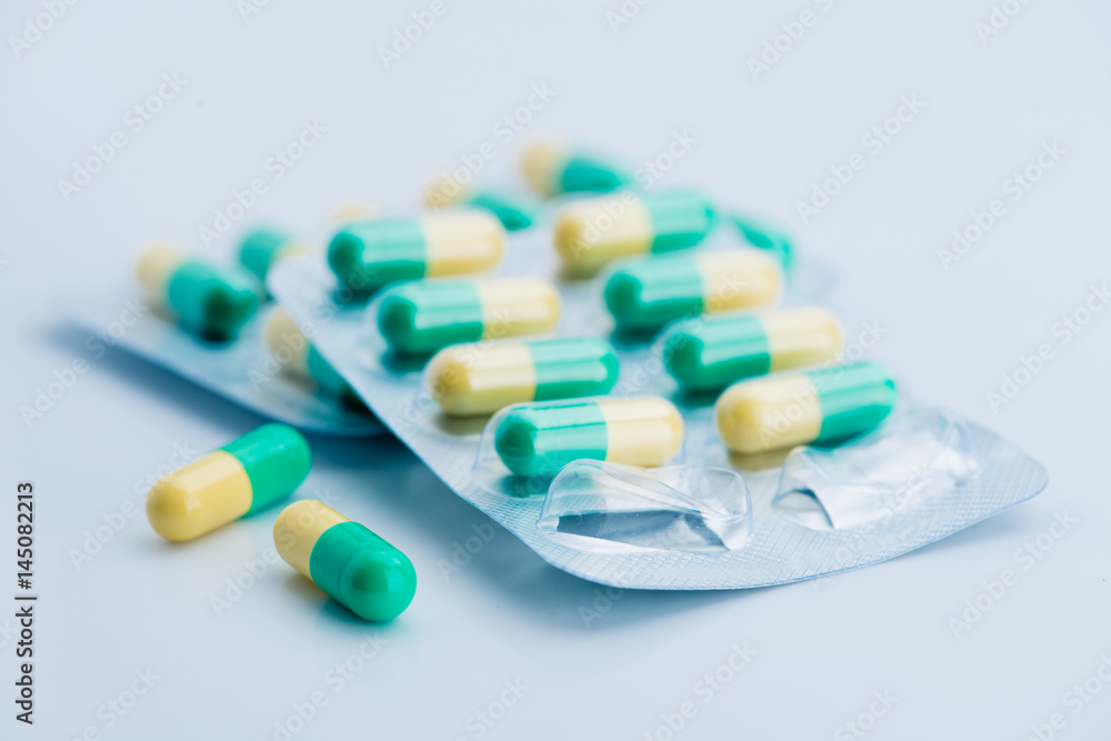 Pile of scattered capsules on a white background Pile of scattered capsules on a white background