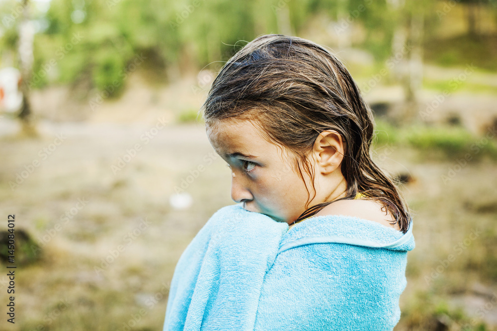 Profile of girl with wet hair wrapped in towel outdoors Stock Photo ...