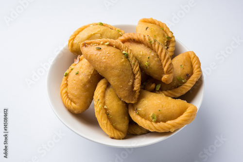 Gujiya - sweet dumplings made during the festival of holi and diwali, selective focus photo