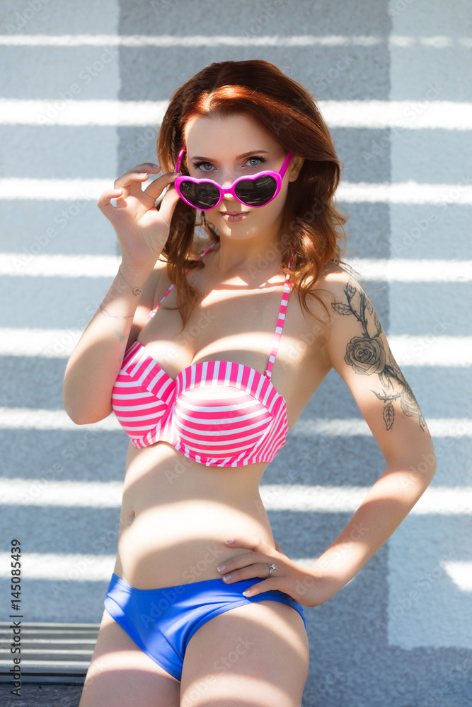 Jeune femme en maillot de bain Stock Photo | Adobe Stock