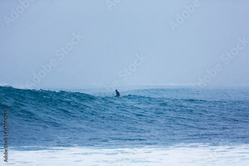 Surfers in a cold water of the north sea
