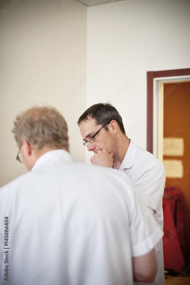 Male doctors standing in office at hospital Male doctors standing in office at hospital