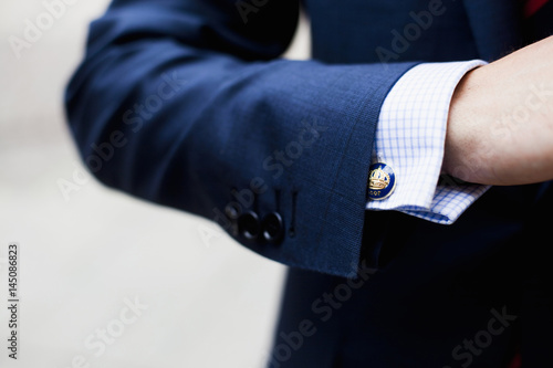 Close up od man's blazer sleeve and shirt cuff
