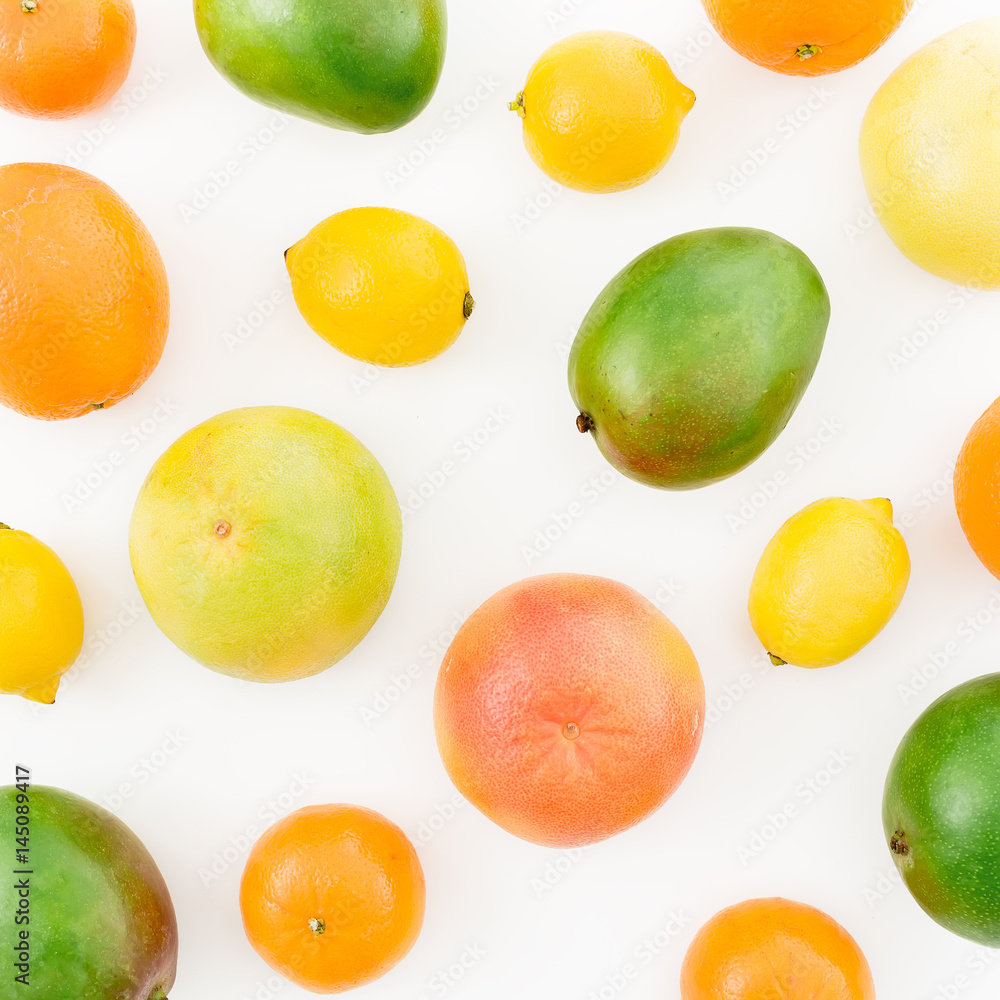 Lemon, orange, grapefruit, sweetie and tasty mango on white background. Flat lay, top view. Food background Lemon, orange, grapefruit, sweetie and tasty mango on white background. Flat lay, top view. Food background