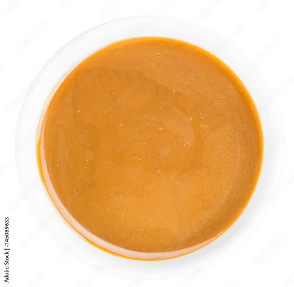 Portion of Caramel Sauce on a slate slab Portion of Caramel Sauce on a slate slab