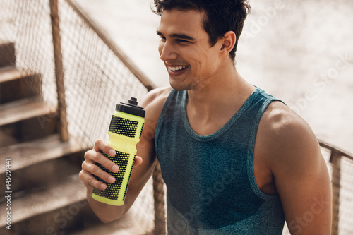 Fototapeta Naklejka Na Ścianę i Meble -  Athlete resting after running