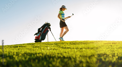 Professional female golfer on golf course