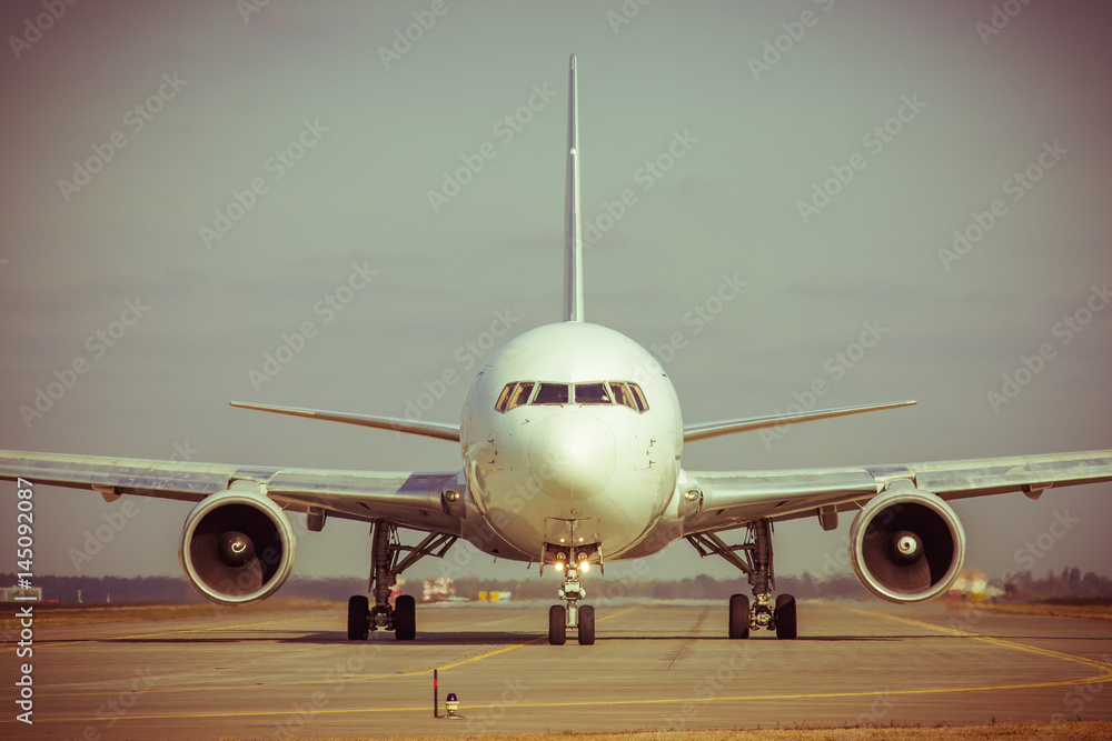 Naklejka premium Passenger plane on runway