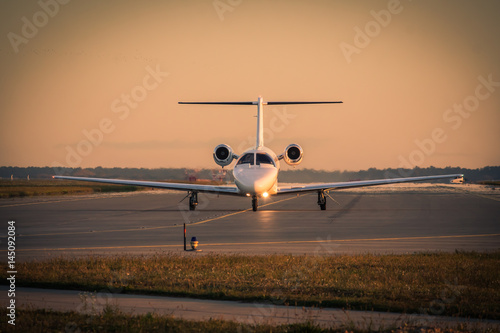 Business jet on sunset