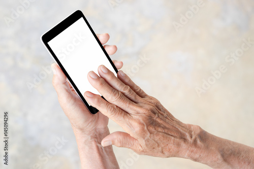 older person, hand holding and touch smart phone with blank white screen