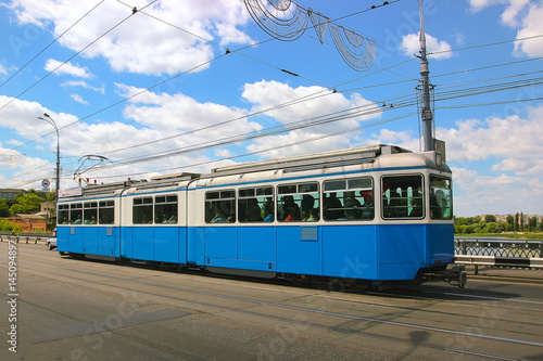 Daily life in the city. Tram of the public transport on street