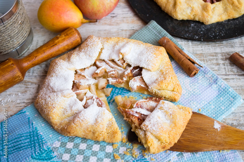 Galeta with apples, pear and cinnamon on blue waffle towel photo